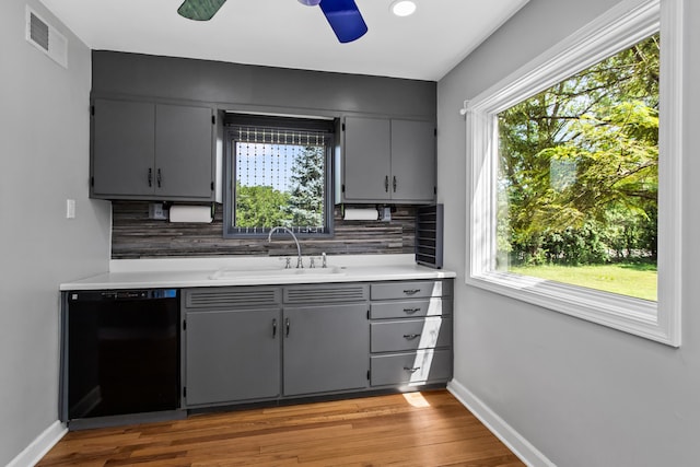 600 W Bloomingdale Rd, Itasca, IL 60143 - kitchen featuring dishwasher, tasteful backsplash, healthy amount of natural light, and gray cabinetry