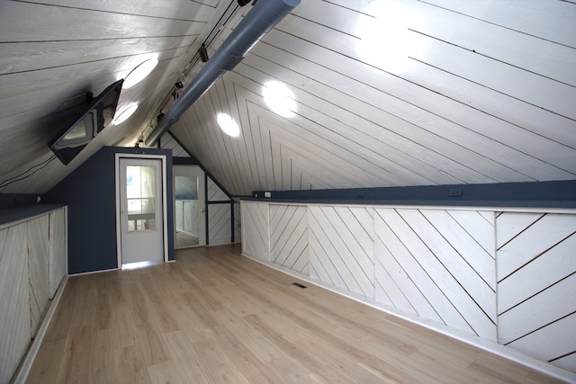 600 W Bloomingdale Rd, Itasca, IL 60143 - additional living space with light wood-style floors, wood walls, and lofted ceiling