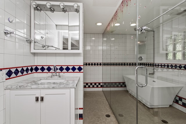 600 W Bloomingdale Rd, Itasca, IL 60143 - bathroom featuring tile walls, a freestanding tub, vanity, recessed lighting, and an enclosed shower