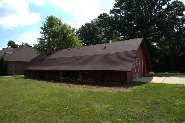 600 W Bloomingdale Rd, Itasca, IL 60143 - view of home's exterior with roof with shingles, a yard, and a chimney