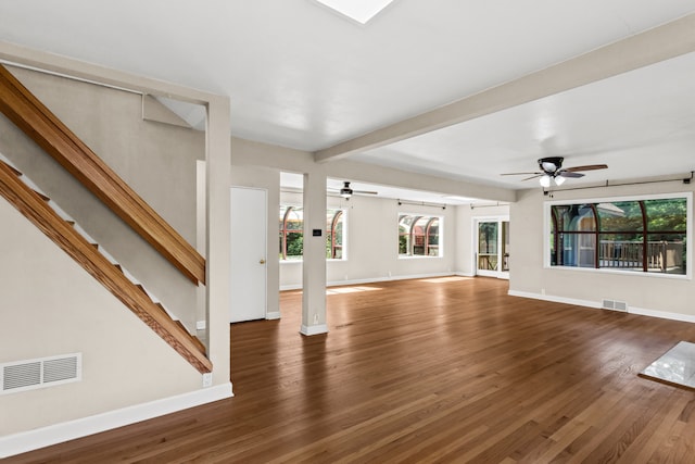 600 W Bloomingdale Rd, Itasca, IL 60143 - unfurnished living room featuring a ceiling fan, wood finished floors, healthy amount of natural light, and beamed ceiling