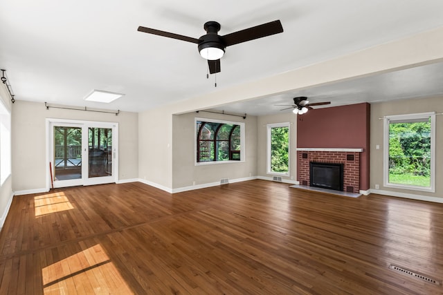 600 W Bloomingdale Rd, Itasca, IL 60143 - unfurnished living room with a ceiling fan, healthy amount of natural light, and wood-type flooring