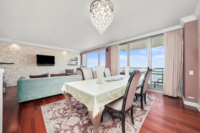 1300 N Lake Shore Dr Unit 10B, Chicago, IL 60610 - dining space featuring wood finished floors, ornamental molding, and a chandelier