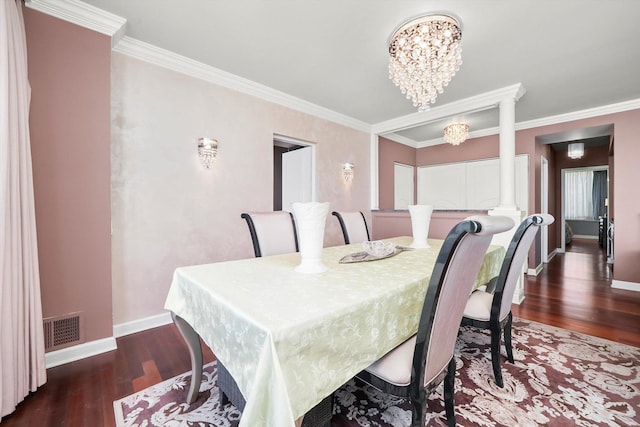 1300 N Lake Shore Dr Unit 10B, Chicago, IL 60610 - dining area featuring wood finished floors, a chandelier, ornamental molding, and ornate columns