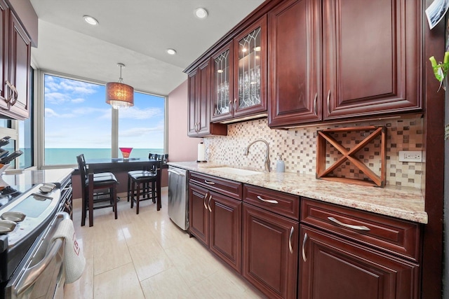 1300 N Lake Shore Dr Unit 10B, Chicago, IL 60610 - kitchen featuring stainless steel appliances, decorative backsplash, light stone countertops, decorative light fixtures, and glass insert cabinets