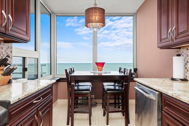 1300 N Lake Shore Dr Unit 10B, Chicago, IL 60610 - dining space with a water view and a chandelier