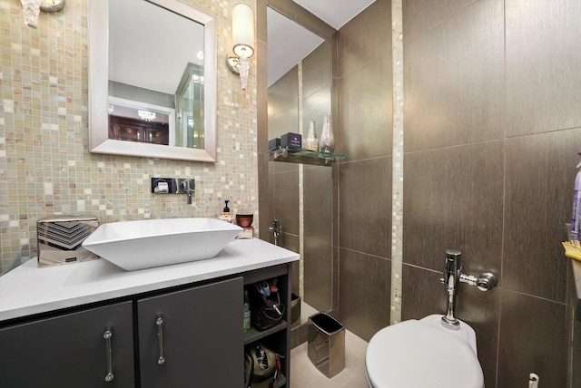 1300 N Lake Shore Dr Unit 10B, Chicago, IL 60610 - bathroom with tile walls, vanity, and decorative backsplash