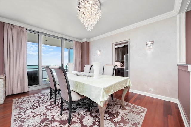 1300 N Lake Shore Dr Unit 10B, Chicago, IL 60610 - dining space featuring dark wood-style flooring, a chandelier, and crown molding