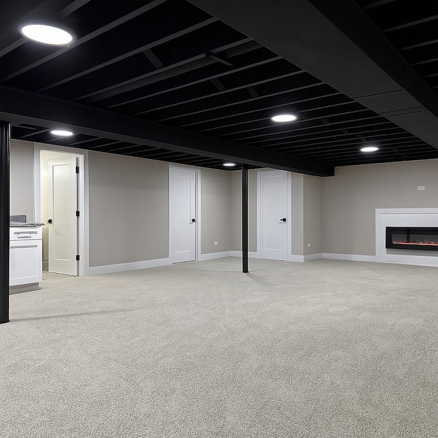 18506 Martin Ave, Homewood, IL 60430 - finished basement featuring light colored carpet and a glass covered fireplace