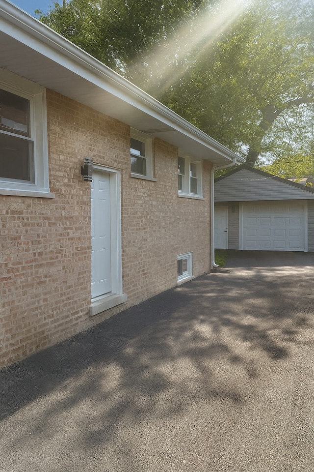18506 Martin Ave, Homewood, IL 60430 - view of side of property featuring brick siding, an outdoor structure, and a garage