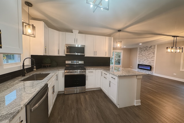 18506 Martin Ave, Homewood, IL 60430 - kitchen featuring stainless steel appliances, dark wood finished floors, open floor plan, white cabinetry, and a peninsula