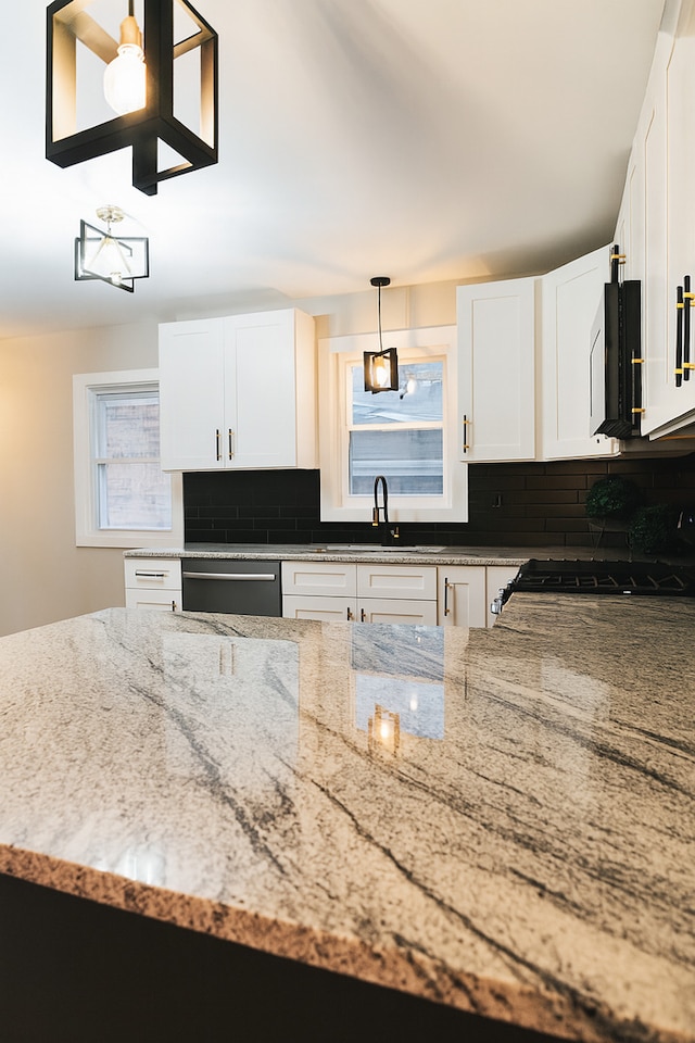 18506 Martin Ave, Homewood, IL 60430 - kitchen featuring stainless steel dishwasher, tasteful backsplash, light stone countertops, and stove