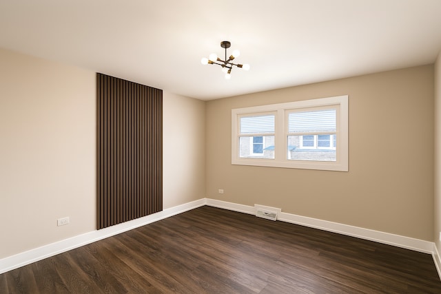18506 Martin Ave, Homewood, IL 60430 - unfurnished room with a chandelier and dark wood finished floors