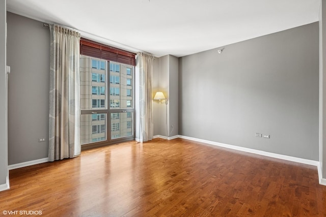635 N Dearborn St Unit 2506, Chicago, IL 60654 - empty room featuring baseboards and wood finished floors