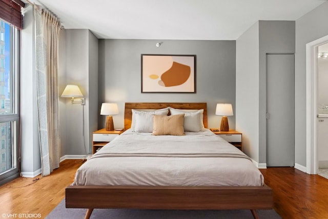 635 N Dearborn St Unit 2506, Chicago, IL 60654 - bedroom with wood finished floors and baseboards