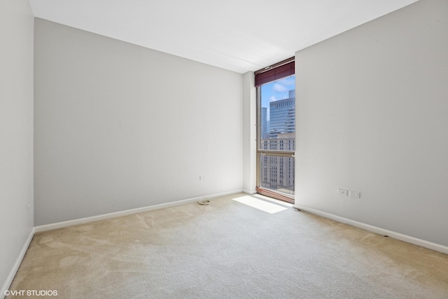 635 N Dearborn St Unit 2506, Chicago, IL 60654 - unfurnished room featuring expansive windows and carpet flooring