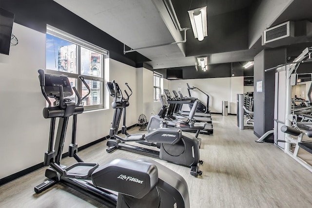 635 N Dearborn St Unit 2506, Chicago, IL 60654 - exercise room with plenty of natural light and wood finished floors