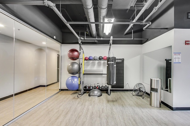 635 N Dearborn St Unit 2506, Chicago, IL 60654 - workout area featuring wood finished floors and a high ceiling