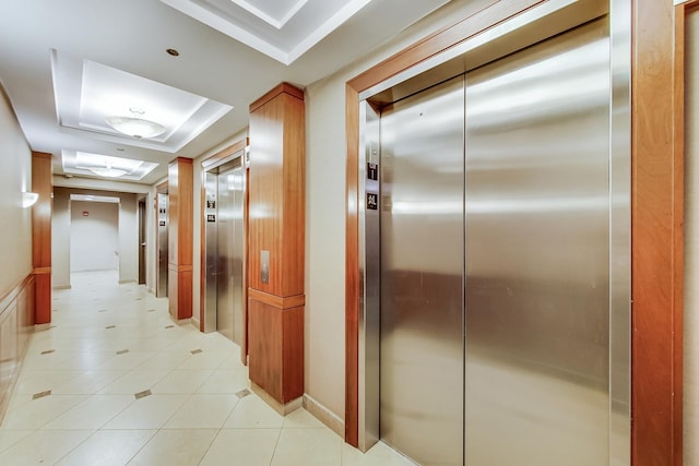 635 N Dearborn St Unit 2506, Chicago, IL 60654 - hall with elevator, a raised ceiling, and light tile patterned floors