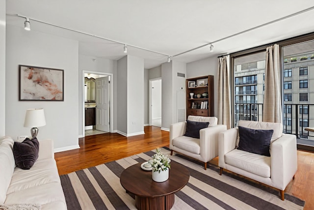 635 N Dearborn St Unit 2506, Chicago, IL 60654 - living area with rail lighting and wood finished floors