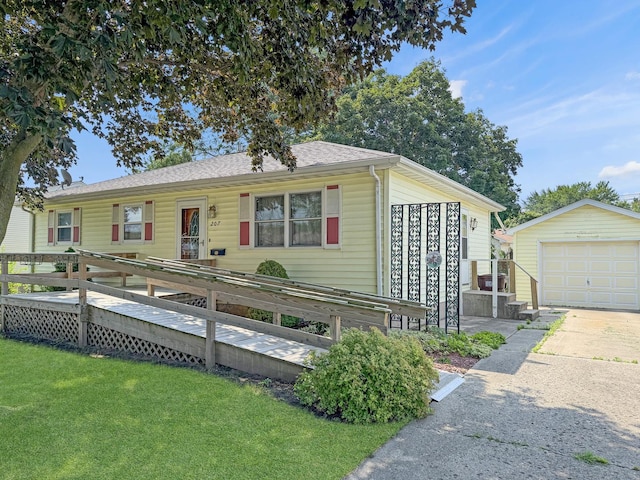 207 Southview Dr, Rochelle, IL 61068 - single story home featuring a front lawn, driveway, a garage, and an outdoor structure