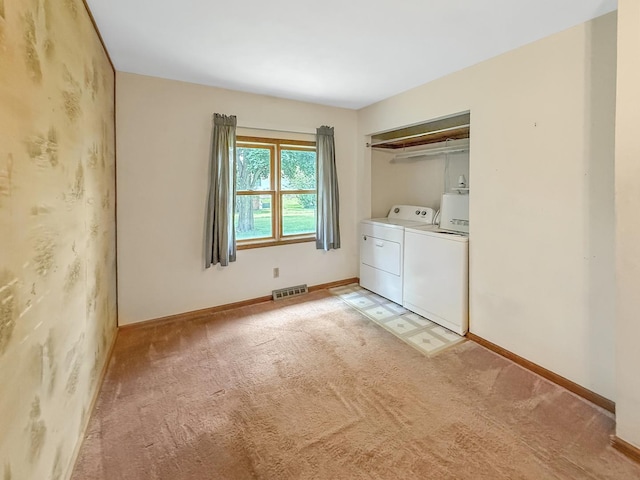 207 Southview Dr, Rochelle, IL 61068 - laundry area with washing machine and clothes dryer and light colored carpet