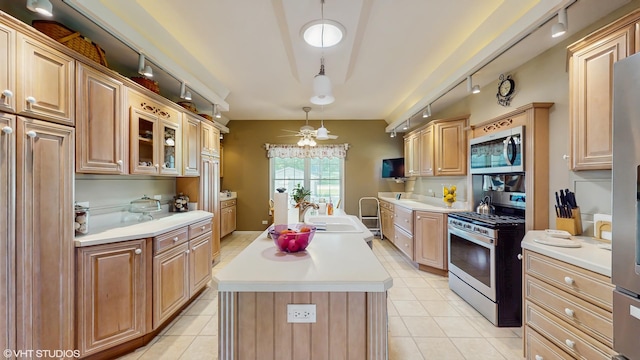 1513 Berwyn St, Spring Grove, IL 60081 - kitchen with appliances with stainless steel finishes, track lighting, a kitchen island, and light countertops