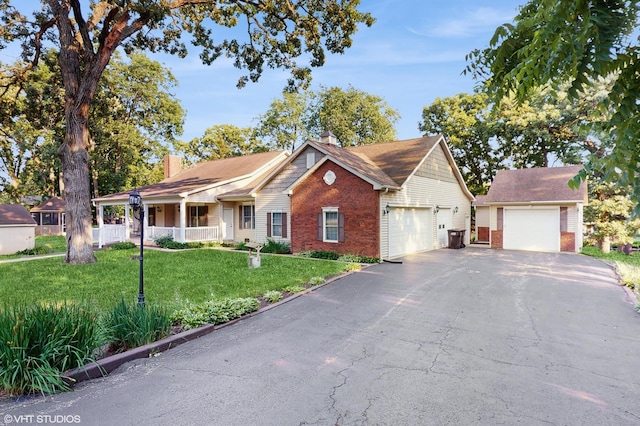 1513 Berwyn St, Spring Grove, IL 60081 - view of front of home with brick siding, a chimney, a garage, and a front yard