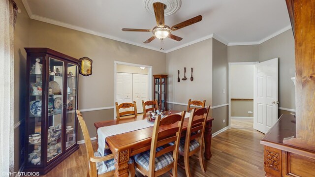 1513 Berwyn St, Spring Grove, IL 60081 - dining room featuring ceiling fan, wood finished floors, and ornamental molding