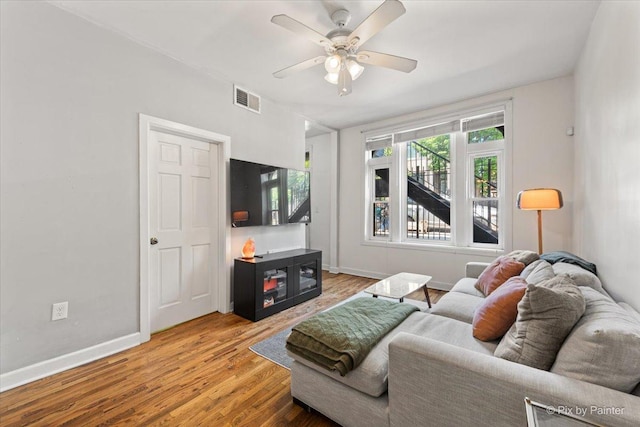 2233 W Shakespeare Ave Unit 1F, Chicago, IL 60647 - living room featuring a ceiling fan and wood finished floors