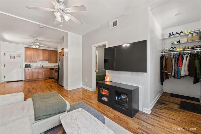 2233 W Shakespeare Ave Unit 1F, Chicago, IL 60647 - living area featuring ceiling fan and light wood-style flooring