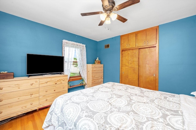 3820 Lombard Ave, Berwyn, IL 60402 - bedroom featuring a closet, wood finished floors, and ceiling fan