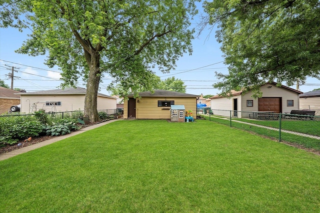 3820 Lombard Ave, Berwyn, IL 60402 - fenced backyard with a detached garage and an outbuilding