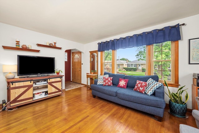 3820 Lombard Ave, Berwyn, IL 60402 - living area featuring wood finished floors, healthy amount of natural light, and arched walkways