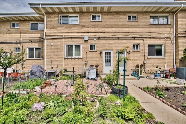 9666 Lois Dr Unit D, Des Plaines, IL 60016 - back of house featuring a patio area and brick siding