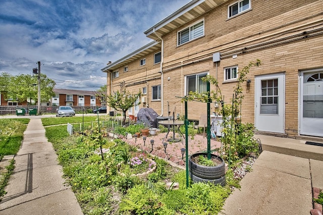 9666 Lois Dr Unit D, Des Plaines, IL 60016 - view of side of home featuring a patio