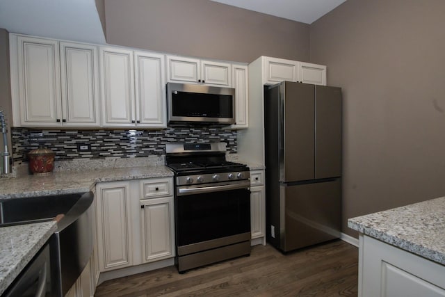 218 Partridge Ct, Algonquin, IL 60102 - kitchen featuring stainless steel appliances, decorative backsplash, dark wood-style floors, white cabinets, and light stone countertops