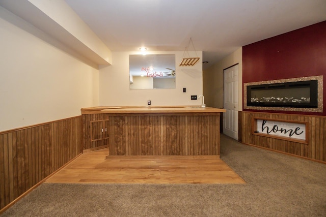 218 Partridge Ct, Algonquin, IL 60102 - bar area featuring light carpet, wood walls, and wainscoting