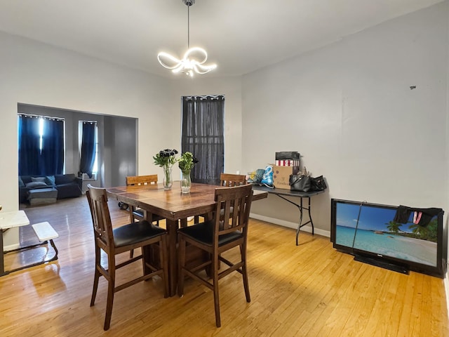 5943 S Indiana Ave, Chicago, IL 60637 - dining room with a chandelier and light wood finished floors