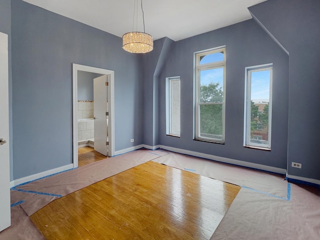 5943 S Indiana Ave, Chicago, IL 60637 - unfurnished dining area featuring baseboards and wood finished floors