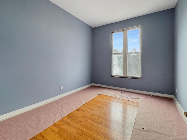 5943 S Indiana Ave, Chicago, IL 60637 - empty room with baseboards and wood finished floors