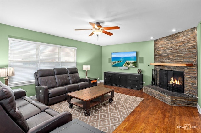 24209 Lavergne St, Plainfield, IL 60585 - living area featuring a ceiling fan, a fireplace, and wood finished floors