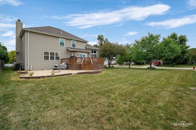 24209 Lavergne St, Plainfield, IL 60585 - back of house featuring a wooden deck, a chimney, a patio, and a lawn