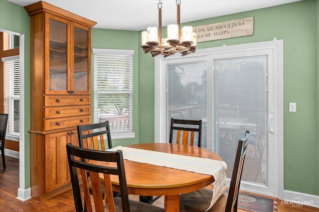 24209 Lavergne St, Plainfield, IL 60585 - dining area with a chandelier and dark wood finished floors