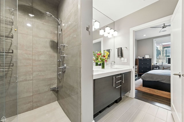 1312 W Madison St Unit 3A, Chicago, IL 60607 - bathroom with ensuite bath, a stall shower, double vanity, tile patterned floors, and ceiling fan