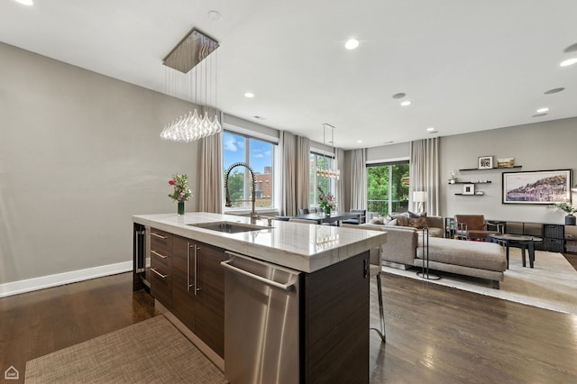 1312 W Madison St Unit 3A, Chicago, IL 60607 - kitchen with stainless steel dishwasher, modern cabinets, dark wood-style floors, dark brown cabinetry, and decorative light fixtures