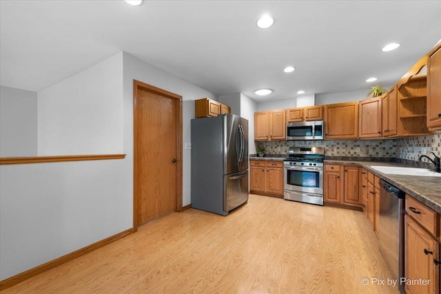 40 S Juniper Dr, North Aurora, IL 60542 - kitchen with appliances with stainless steel finishes, open shelves, dark countertops, light wood-style floors, and recessed lighting