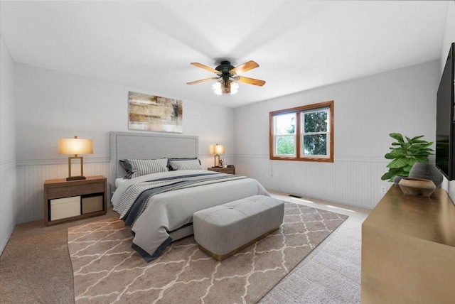 40 S Juniper Dr, North Aurora, IL 60542 - bedroom featuring a wainscoted wall, carpet flooring, and a ceiling fan