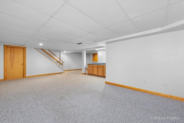 40 S Juniper Dr, North Aurora, IL 60542 - finished below grade area with light colored carpet, a drop ceiling, and stairway