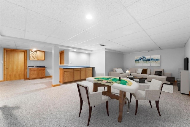 40 S Juniper Dr, North Aurora, IL 60542 - dining area featuring bar with sink, a drop ceiling, and light colored carpet